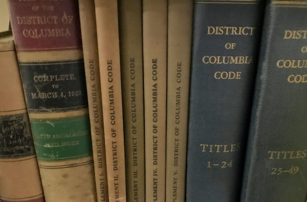 shelf of old DC Code volumes