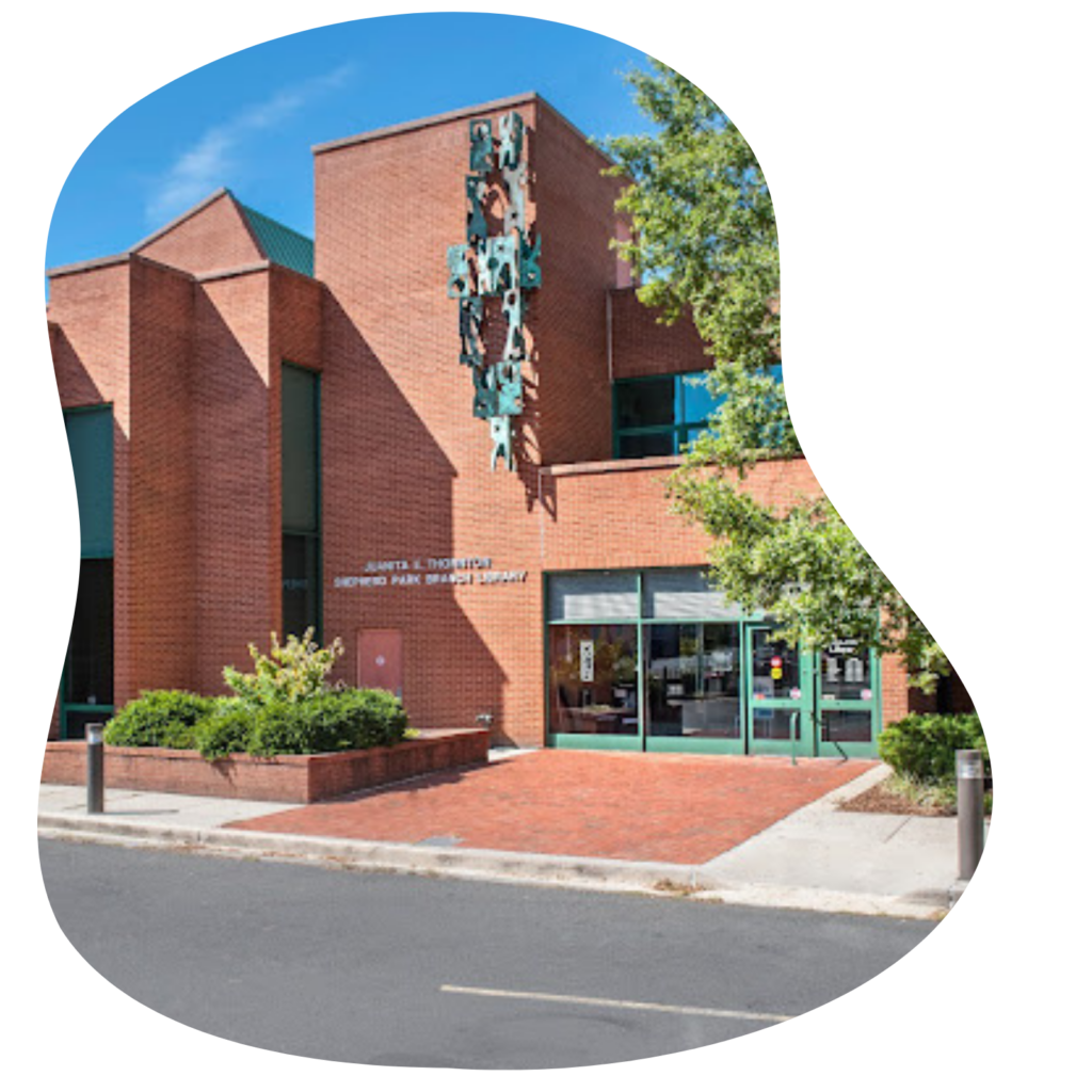 brick library with metal artwork hanging on the wall